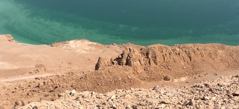 Track down the cliff to the Dead Sea.