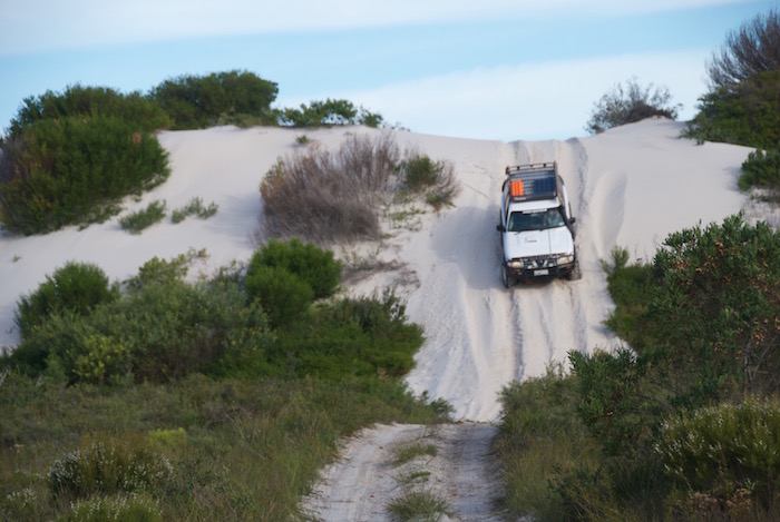 Graham drives down the dune.