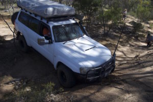 Jon takes his Patrol across a gutter.