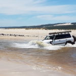 Graham takes his Patrol though the Warren River.
