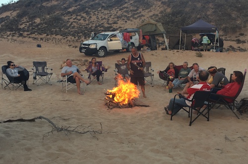 Campfire behind the dunes.