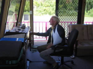 John Haynes driving boat.