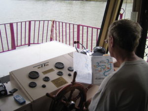 John at the helm.