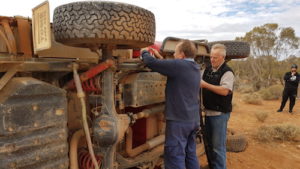 Preparing to right the vehicle.