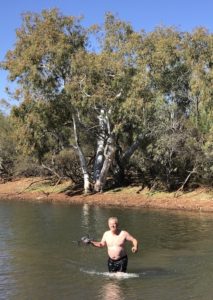 Scott retrieves drone.