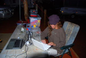 Arranging photos at camp.