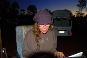 Tammy preparing photos at our camp at Yulara.