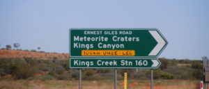 At the intersection of Lasseter Highway and Ernest Giles Road.