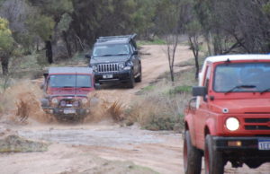 Mike splashes through another puddle.