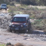Mike takes his Jeep through the mudhole.