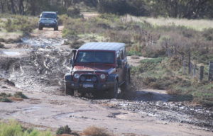 Mike takes his Jeep through the mudhole.