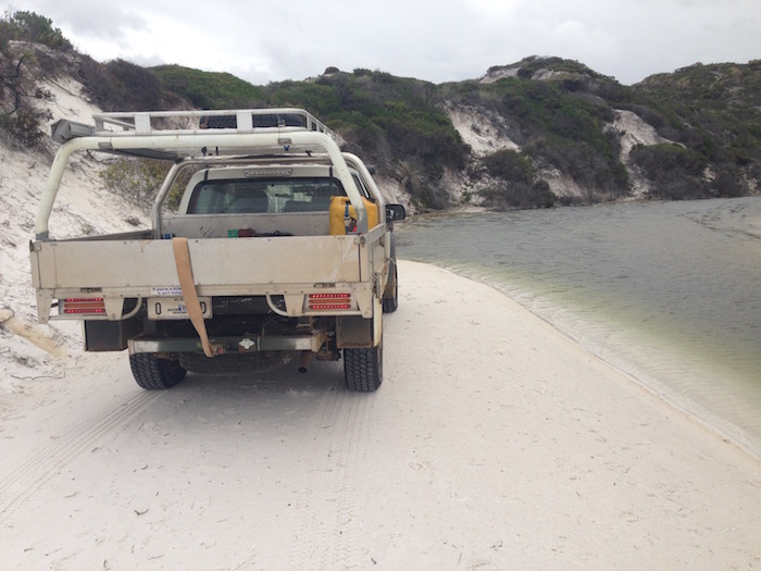 An unnamed creek flows across the beach at Rossiter Bay.