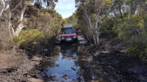 Scott in his Jimny on the track to Gordon Inlet.