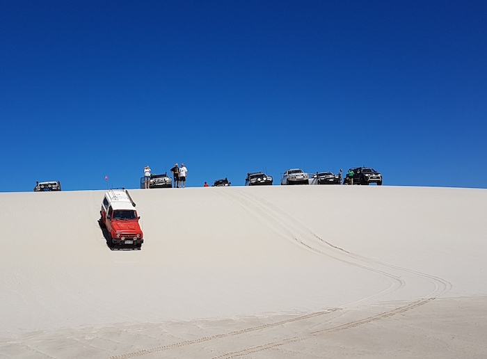 Cliff takes his Maruti down the dune.