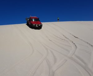 Aaron takes his Patrol down the dune.