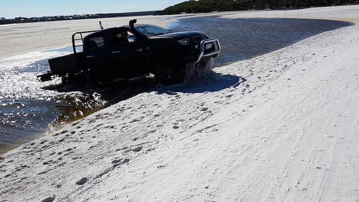 Phil takes his Triton through water near the mouth of the Bremer River.