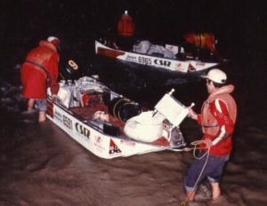 Roping the boats around Bourke Weir in the darkness of early morning.