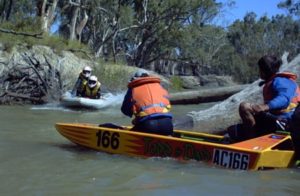 John and Stephen jump a log on the Mullaroo Creek.