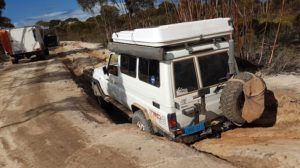 Troopy in deep gutter ready to be retrieved by Patrol.