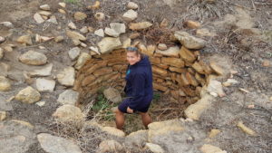 Nicole removing weeds at Burracoppin Well.