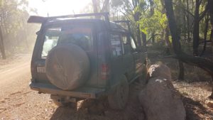 Driving into a setting sun through dust on a ball bearing gravel road on a bend and the result is not good.