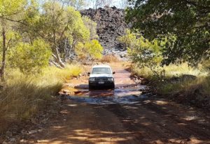 Sandy drives her Explorer through the Lennard River.
