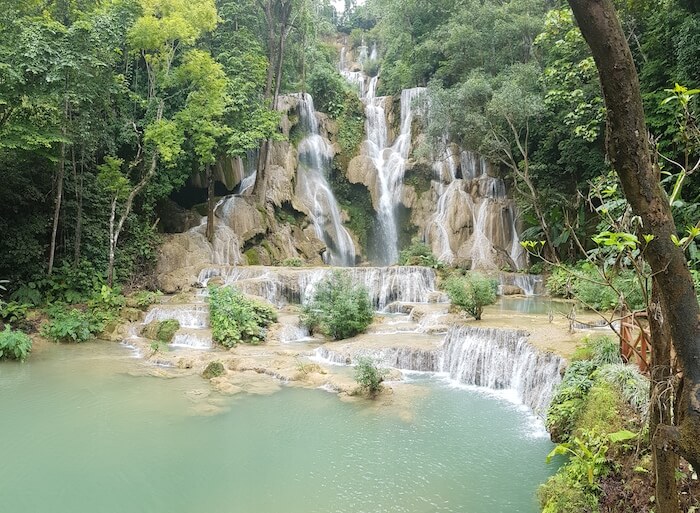 Kuang Si Falls gently cascades 50 metres over four stepped pools.