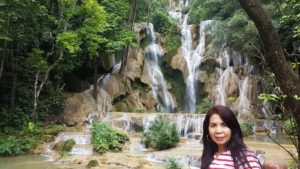 Tassy in front of the waterfall.