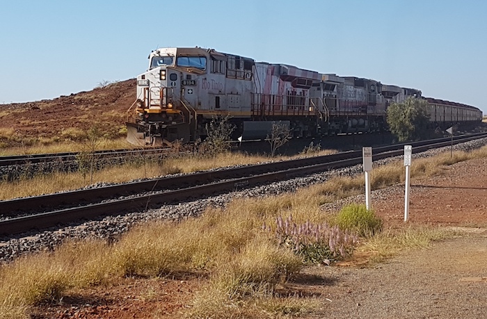 Rio Tinto train hauling 140 wagons of iron ore up Barowanna Hill.