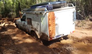Scott drives the Patrol through the Muddy Landing Road mudhole.