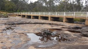 The bridge is built on top of the falls.