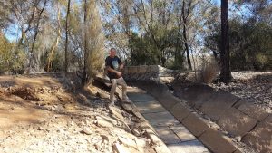 Greg at the outfall to the first dam.