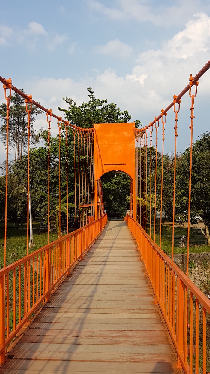 The unexceptional suspension bridge painted orange for effect.