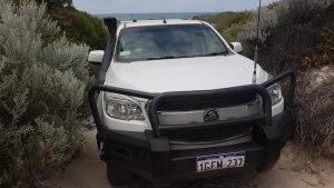 Greg drives his Colorado off the beach south of Grey.
