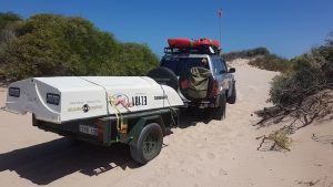 Aaron towed the trailer through the dunes to the beach.