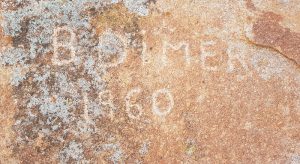 B. Dimer etched his name into the rock in 1960.