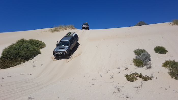 Sean takes his Colorado over a dune
