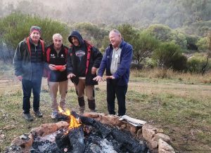 Jeff, Greg, Joe and Kim around the campfire early Saturday morning