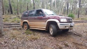 Joanne takes the Jackaroo off the railway.