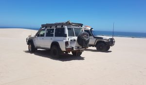 Matt and Tania in the GQ and Brad and Julie in the Troopy on top of Lucky Bay dunes.