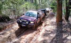Matt and Tania in Navara with camper trailer through washaway.