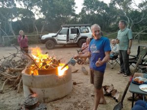 Greg applies the modern day version of the bellows to the campfire at Starvation Bay Campground.