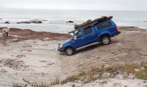 Graham and Kim watching Peter drive Prado down rock