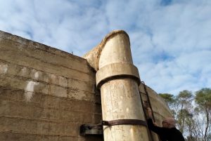 Graham climbs the ladder to check the amount of water in the Tank.