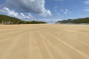 Wide open shore leading to the mouth of the inlet.
