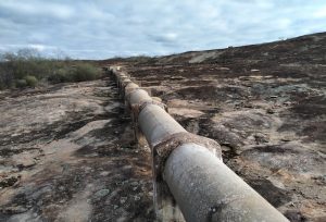 This pipe carries water from the harvest walls to the storage tank.