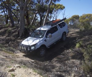 Kevin takes his vehicle through gutter.