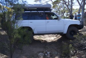 Patrol straddling gutter.