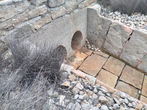 Pipes under track. The pipes connects the upper reservoir to the main reservoir.