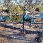 The relocated plaque and an accompanying plaque explaining the reason for the relocation at Hunt’s Dam at Karalee.